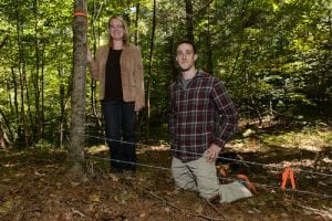 man and woman in the woods 