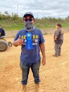 Diego with his first place ribbon after winning a class at the Litchfield County 4-H Garden Tractor Pull