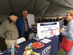 people standing at a table talking