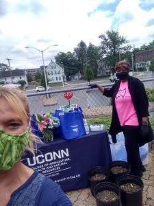 Heather and a volunteer in their masks