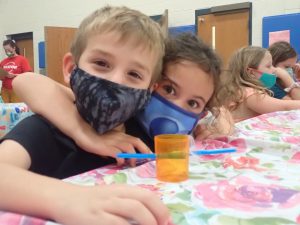 two kids hugging