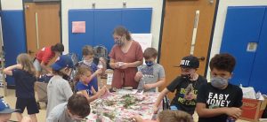 youth around table doing activity