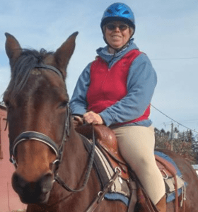 Jennifer riding a horse