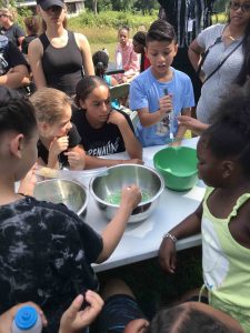 Youth participating in a ruminant digestion activity with their UConn 4-H Adventures in Agriculture program.