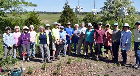 master gardener volunteers in front of a garden