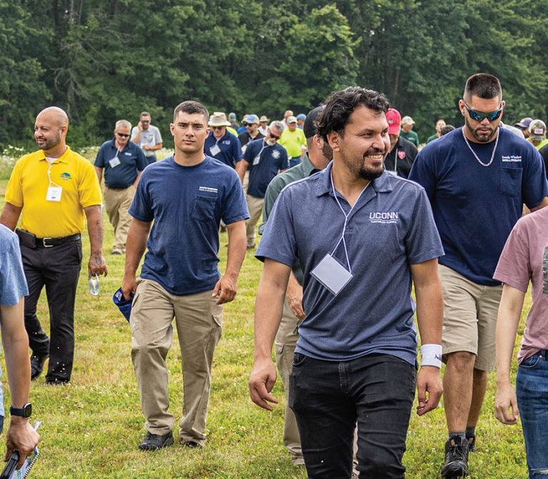 a group of people walking in a field