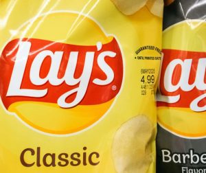 A close up picture of a bag of chips, showing the "guaranteed freshness" date.