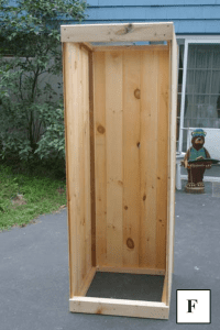 A view of a partially constructed interrior of a smokehouse.