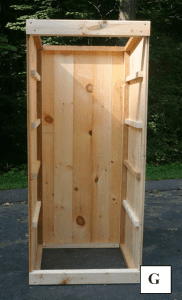 A view of a partially constructed interrior of a smokehouse.