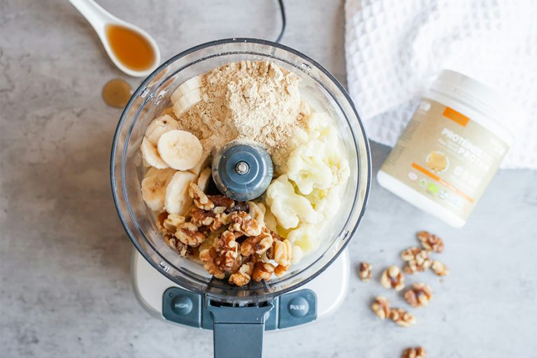Blender full of healthy food and protein powder.